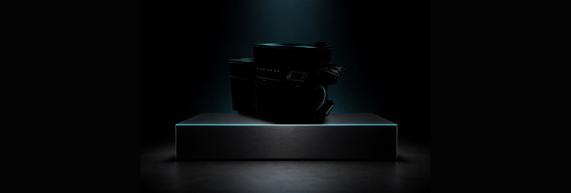 A new DTF production system, lit on a plinth in a darkened hall